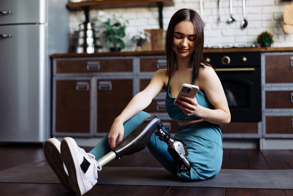 Lady,With,Prosthetic,Limb,Sits,On,Mat,To,Relax,After